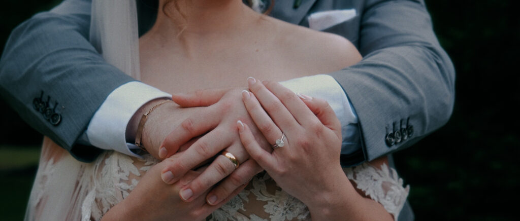 Dallas Wedding Videographer | Adrienne and John | Bethel Rock in Leonard, TX - close up hand shot with ring