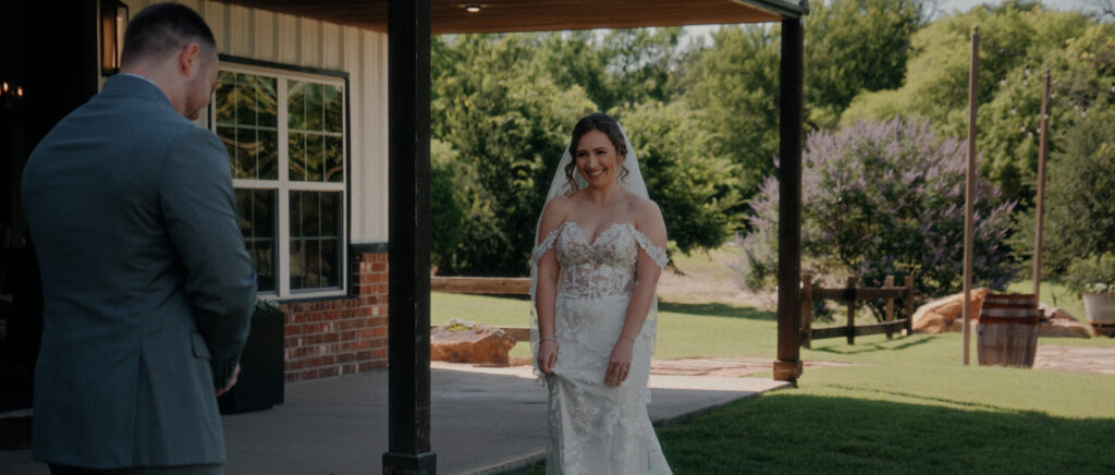 Dallas Wedding Videographer | Adrienne and John | Bethel Rock in Leonard, TX - bride excited during first look