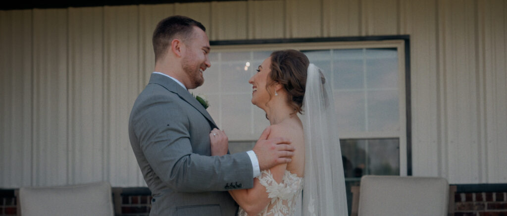 Dallas Wedding Videographer | Adrienne and John | Bethel Rock in Leonard, TX - couple laughing during first look