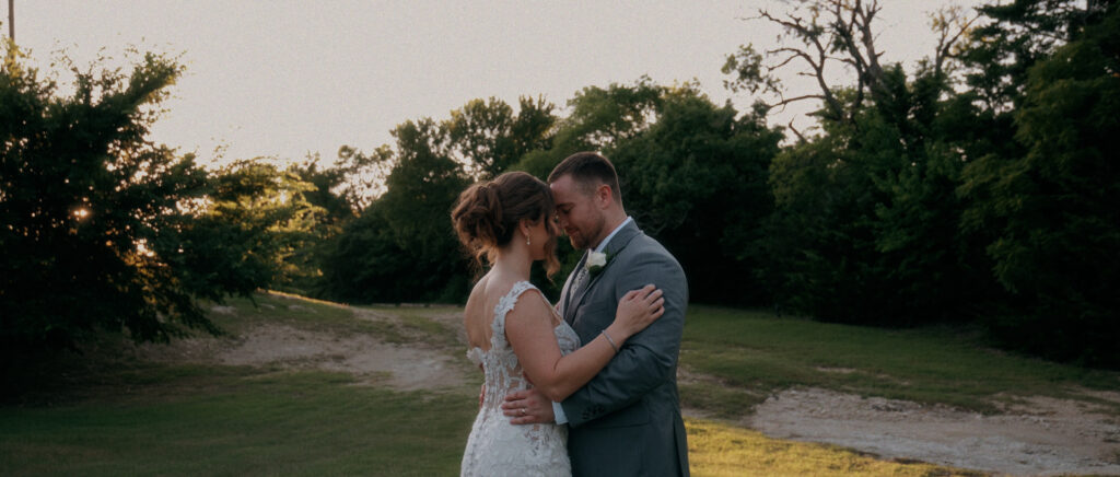 Dallas Wedding Videographer | Adrienne and John | Bethel Rock in Leonard, TX - couple forehead to forehead during sunset