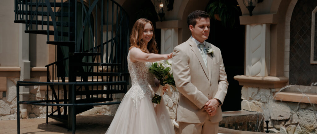 Dallas Wedding Videographer | Ryleigh and Noah | Aristide in Colleyville, TX - first look with bride tapping groom on the shoulder