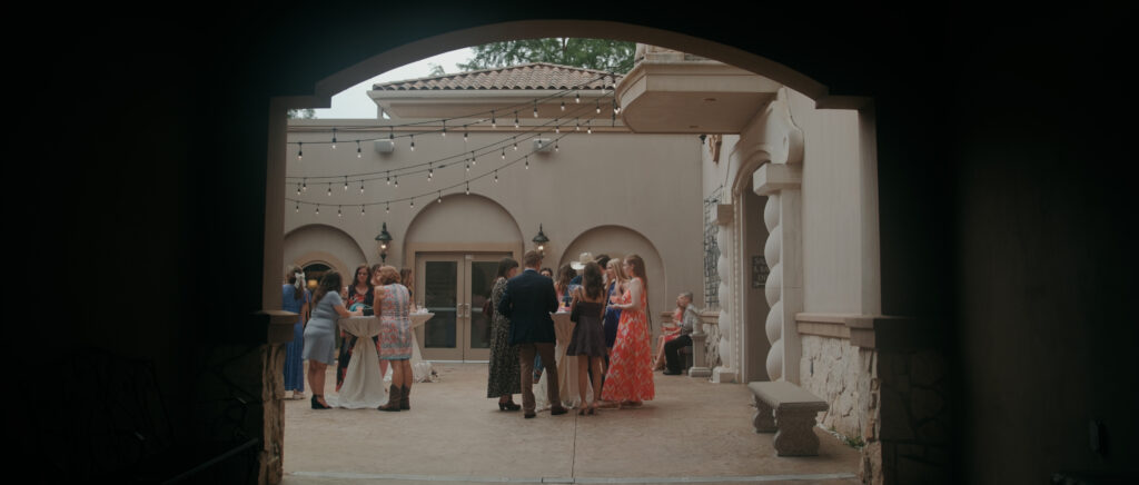 Dallas Wedding Videographer | Ryleigh and Noah | Aristide in Colleyville, TX - cocktail hour in the courtyard at Aristide