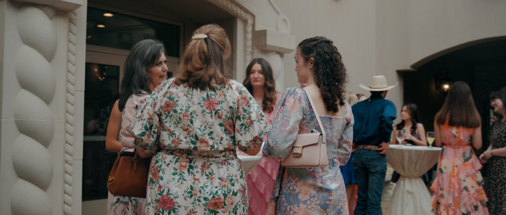 Dallas Wedding Videographer | Ryleigh and Noah | Aristide in Colleyville, TX - guest talking during cocktail hour