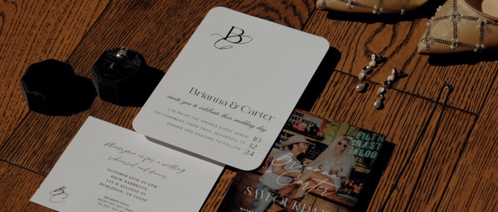 Dallas Wedding Videographer | Brianna and Carter | The Springs Event Venue in Alvarado, TX - wedding invitation flat lay
