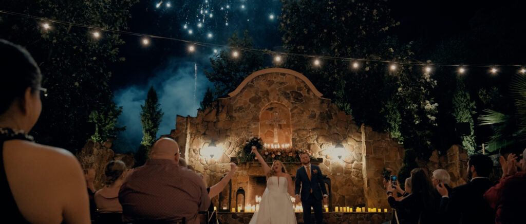 Videography for Wedding Dallas | Houston Wedding Videography | Amanda and Jacob | - recessional with bride and groom walking down aisle with fireworks in background