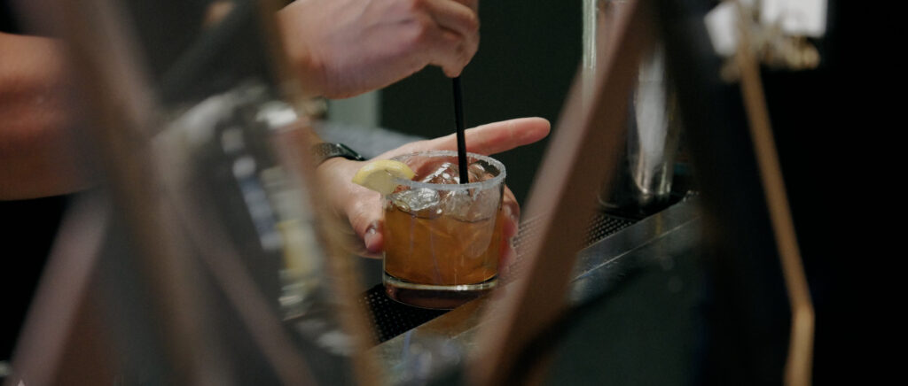 Videography for Wedding Dallas | Austin Wedding Videography | Molly and Oliver | - bartender mixing drink during cocktail hour
