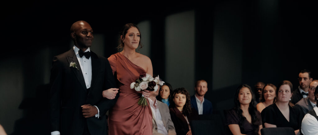 Videography for Wedding Dallas | Austin Wedding Videography | Molly and Oliver | - Molly's sister and Oliver's brother walking down the aisle during ceremony