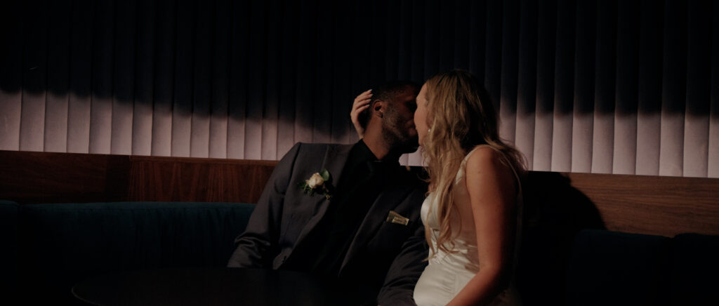 Videography for Wedding Dallas | Austin Wedding Videography | Molly and Oliver | - Oliver and Molly kissing in the hotel speakeasy at the end of their wedding night