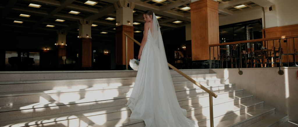 Videography for Wedding Dallas | Tegan and Dayd | - Crazy Water Hotel Wedding Video - bridal portrait on the hotel stairs