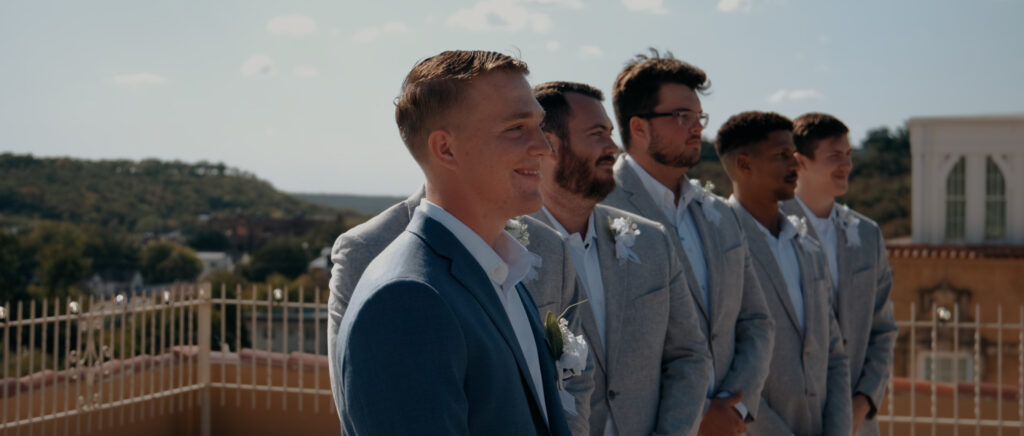 Videography for Wedding Dallas | Tegan and Dayd | - Crazy Water Hotel Wedding Video - Groom smiling as he sees bride walk down aisle
